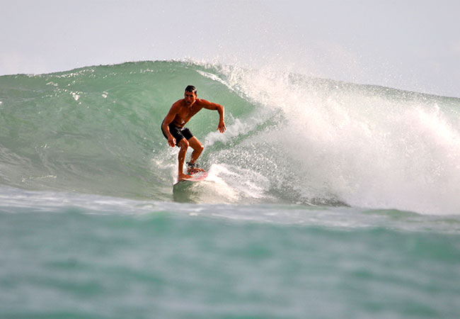 Man surf on wave in Honolulu