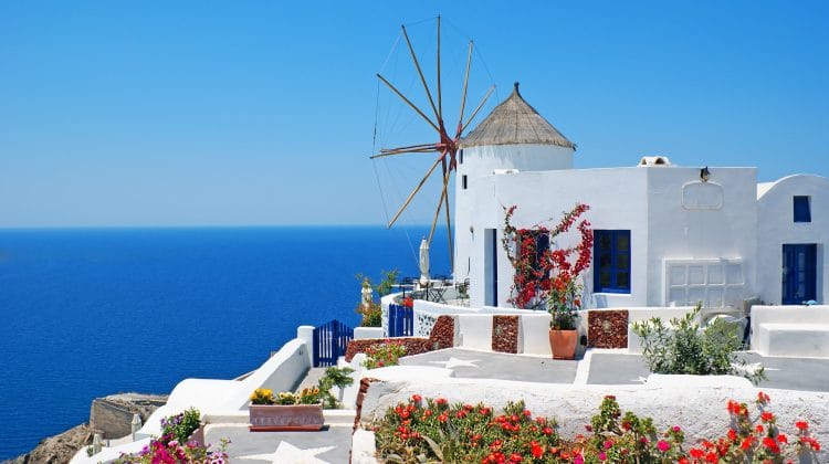 Traditional whitewashed architecture of Oia village at Santorini island in Greece